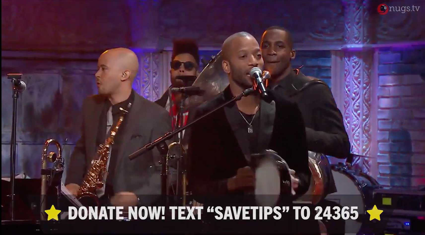 Screenshot from livestream with "Donate now! Text SAVETIPS to 24365."